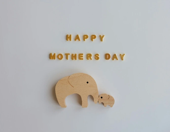 Happy mothers day with wooden elephants